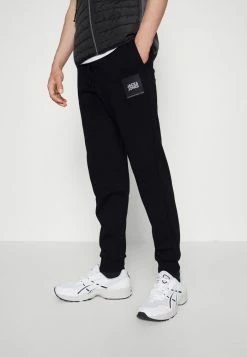 Jack & Jones JPSTGORDON JJJILOCK PANTS - Tracksuit Bottoms - Black