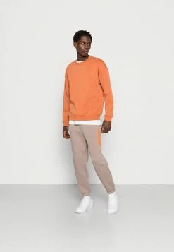 Jack & Jones JJIKANE BRINK CLUB - Tracksuit Bottoms - Fungi/sun Orange -Jack & Jones Shop 2c192a0f58a14a5db0957aaeb610aca4