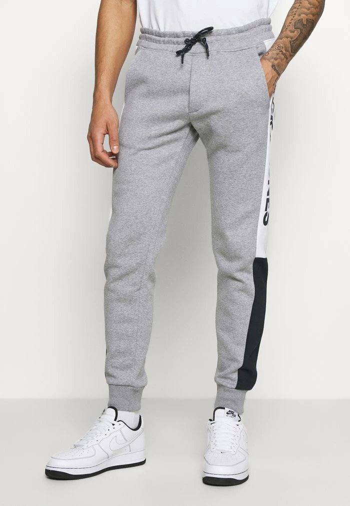 Jack & Jones JJIWILL LOGO JJBLOCKING P. VG NOOS - Tracksuit Bottoms - Light Grey Melange 1 Jack & Jones JJIWILL LOGO JJBLOCKING P. VG NOOS - Tracksuit Bottoms - Light Grey Melange